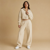 Ensemble de survêtement molletonné pour femme, coupe ample et épaisse, avec sweat à capuche zippé et pantalon de survêtement large, couleur unie, coupe courte et carrée