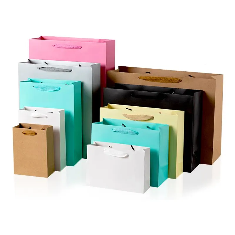 Embalaje de cartón de lujo personalizado, bolsa de papel de compras artesanal de regalo Kraft marrón con asas de cinta