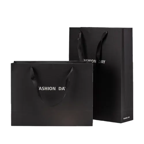 Vente en gros papier personnalisé Logo imprimé emballage artisanal sac cadeau en papier noir avec poignée