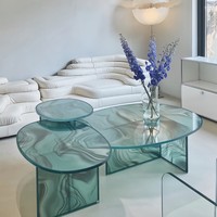 Table basse ovale en verre transparent à motif tourbillonnant, plateau asymétrique, modèle vague, style contemporain de luxe pour la maison