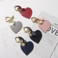 Porte-clés en cuir en forme de cœur pour femme, porte-clés en cuir en forme de cœur tendance, porte-clés de voiture, porte-clés de maison, breloque pour sac, pendentif de voiture, cadeau