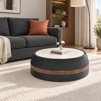 Table basse moderne en forme de tonneau avec plateau en cuir souple et bordure noire, construction en bois durable, design rotatif pour salon et usage domestique