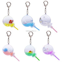 Vente en gros d'usine, porte-clés personnalisé avec mini tortue scintillante, boule flottante ronde, liquide transparent, bonbon sucette