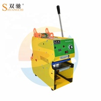 Shuangchi Électrique Bubble Tea Boba Jus Tasse Machine À Sceller Papier Matériel Main Manuel Plateau De Table Scellant pour Lait Boissons
