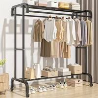 Porte-vêtements à roulettes robuste en métal noir à double barre, avec barres de suspension doubles, roues verrouillables et étagère de rangement inférieure