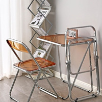 Chaise pliante à cadre métallique transparent, design moderne et épuré, chaise photo tendance pour magasins de vêtements et repas à domicile
