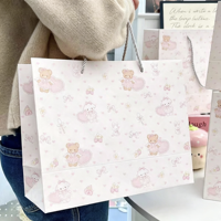 Sacs cadeaux en papier recyclable rose avec poignée en corde pour l'emballage des bougies
