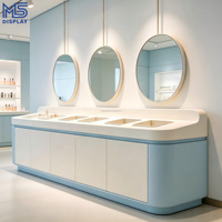 Comptoir d'exposition ovale moderne avec éclairage LED intégré et étagère murale pour boutique de beauté, parfumerie et aménagement de magasin