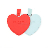 Petit miroir de maquillage portable en cuir PU fantaisie avec deux pendentifs breloques pour sac