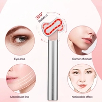 Masseur oculaire rotatif à lumière rouge avec microcourant, vibration et chauffage pour les cernes et le massage facial