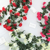Großhandel Handgefertigte Neue Oncidium Hängende Blumenranken Seiden-Kunstblumen Wandmontierte Orchideen Hochzeitsblumenwand Foto-Requisiten für Zuhause