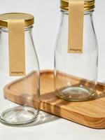 Vente en gros de bouteilles en verre transparent de 300 ml avec bouchons à vis pour jus, eau, lait, thé, boissons