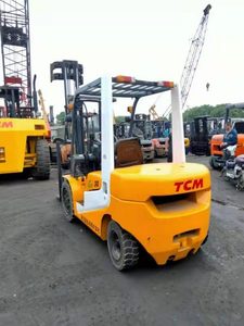Used 3 Ton Mini TCM <b>Forklift</b> FD30 USA Diesel Engine 4WD Rough Terrain Three Stage Mast Solid Tires - Product Image 1