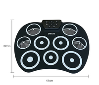 Batterie de percussions électriques pour enfants, éveil musical, noir/blanc/jaune, construction en silicone + plastique tendance