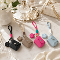 Étui de voyage rigide et résistant à l'eau pour écouteurs, en EVA, portable, durable et léger, avec dragonne et pendentif fleur