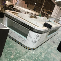 Comptoir de buffet moderne en Corian avec éclairage LED personnalisé pour restaurant, table de présentation alimentaire pour usage commercial hôtelier, durable