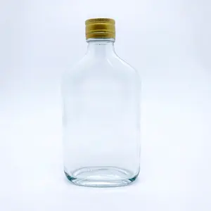 In stock wholesale oblique shoulder flat flask empty glass wine bottles for liquor cold brew coffee liquid soda water juice beverage