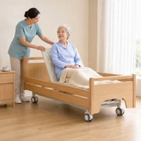 Lit médical manuel réglable à double manivelle, style domestique, avec panneaux en bois, relevage du dossier et des jambes, et rails rabattables