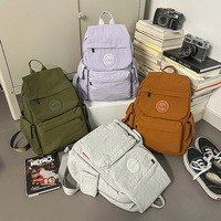 Sac à dos d'extérieur léger et tendance Nouveau sac à dos de voyage simple et polyvalent pour femmes Sac pour filles
