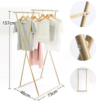 Vente en gros de supports portables pliables en métal à double pôle pour le séchage des vêtements d'intérieur et d'extérieur avec séchoir pour balcon et salle de bain