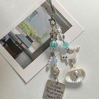 Nouveau design original, petit pendentif coquillage chat d'été, chaîne de téléphone portable, chaîne d'appareil photo, cadeau, ornement suspendu pour la maison, porte-clés