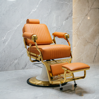 Fauteuil de barbier de luxe avec cadre plaqué or, revêtement en cuir PU orange-brun, appui-tête réglable, inclinable, équipement de salon de coiffure