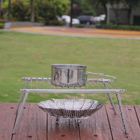 Barbecue au charbon de bois portable mini en acier inoxydable avec chariot au design moderne, tube rond pour le camping en plein air
