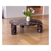 Table basse en marbre foncé Emperado avec quatre pieds cylindriques