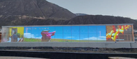 Écran LED transparent en maille extérieure haute luminosité GUOJIA Factory P3.91*7.82 pour la publicité murale extérieure des bâtiments