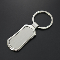Porte-clés logo gravé souvenir immobilier en forme de maison en métal de mode personnalisée