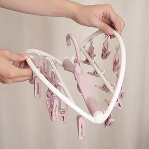 <span class=keywords><strong>Cintre</strong></span> rotatif multifonction avec de nombreux clips, idéal pour sécher les chaussettes et les sous-vêtements à la maison - Product Image 1
