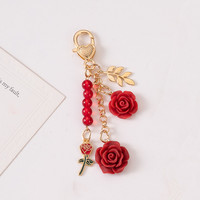 Porte-clés en résine en forme de rose avec pendentif pompon pour femmes et filles - Accessoire de mode durable et écologique