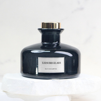 Diffuseur d'arômes rond noir de luxe de 180 ml avec bouchon en liège et roseau, design élégant, populaire dans un emballage en carton