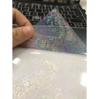 Film de plastification à froid holographique en feuille de sable, film de recouvrement auto-adhésif BOPP pour affiches, cartes, emballages DIY, estampage à chaud et lamination