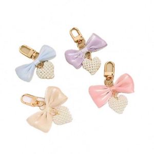 Llavero con lazo dulce, lazo de mariposa, cadena de perlas de imitación, colgante para teléfono, correa para bolso, cordón para celular, llavero - Product Image 3