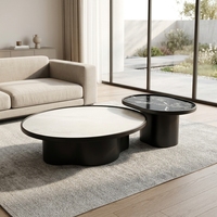 Ensemble de tables basses élégantes et discrètes, en stratifié Midnight, avec un espace de conversation horizontal proportionnel et soigné à niveaux superposés