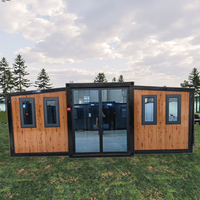 Maison en bois préfabriquée de luxe de 2 chambres à coucher Panneau sandwich en acier Module d'expédition extensible mobile bon marché pour le salon Bar à la maison