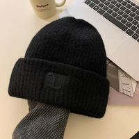 Bonnet tricoté souple pour femme, style coréen, avec cache-oreilles, chaud et décontracté, pour l'hiver et les activités de plein air