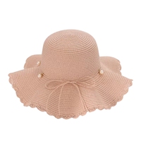 Vente en gros de chapeau de paille sombrero pour femme élégante tendance printemps été pêche spray perle nœud large bord chapeau de protection solaire jonc herbe
