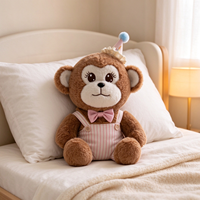 Peluche singe marron en gros, jouet animal en peluche avec tenue de fête, logo personnalisé pour boutique de cadeaux, machine à griffes de distributeur automatique