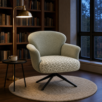 Fauteuil de salon avec revêtement texturé, coussin de siège floral, base pivotante en métal noir, chaise réglable en hauteur