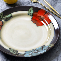 Assiette de présentation en céramique grès à motif floral dessiné à la main, technologie de glaçure rétro, écologique et durable, pour plats principaux de fête
