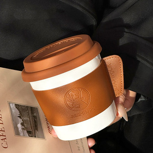 แก้วกาแฟเซรามิกคุณภาพสูงรุ่นใหม่ พร้อมฝาปิดและปลอกหนัง แก้วของขวัญปรับแต่งได้สำหรับใช้ในบ้านและของที่ระลึกสำหรับองค์กร - Product Image 5