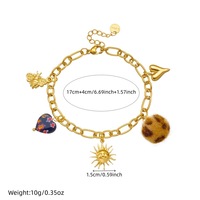 Nouveau bracelet à breloques tendance en acier inoxydable plaqué or 18 carats avec breloques soleil, cœur et pompon pour femme