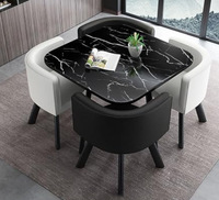 Ensemble de table à manger ronde moderne de luxe comprenant quatre chaises et une table basse avec un design gain de place