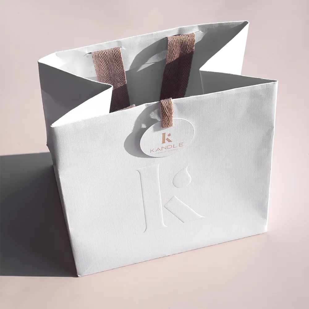 Produttore Logo personalizzato gioielli cosmetici di lusso sacchetto di imballaggio Shopping sacchetti di carta regalo per il Business dell'abbigliamento