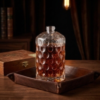 Bouteille en verre de vodka personnalisée avec motif en relief, 700 ml, 750 ml, bouteilles à spiritueux transparentes rondes en verre silex, vente en gros