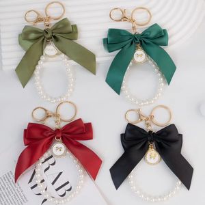 Elegante llavero de Metal con lazo multicolor con lazo de perla delicado encanto de moda duradero <span class=keywords><strong>accesorios</strong></span> de bolso con estilo para <span class=keywords><strong>mujer</strong></span> - Product Image 1