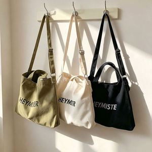 Oversized Canvas Crossbody Messenger Tote <b>Bag</b> for <b>College</b> Girls with Eco-Friendly Reusable Design and Custom Logo Printing - Product Image 1