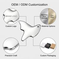 Outil multifonctionnel Gua Sha en acier inoxydable 304 OEM pour lifting du visage, raclage corporel, drainage lymphatique et massage par acupression